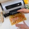 Nesco Premium Vacuum Sealer Kit featuring LiquidLock™, Includes large variety of Bags and Rolls VS-22LB, Built-in Canister Sealing Function